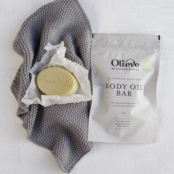 Olieve and Olie olive oil soap bar on a grey washer. Custom Gift Hamper. the Petal Provedore.